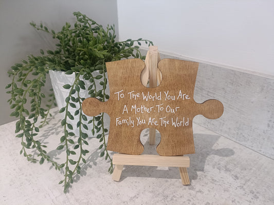 To the world you are a mother. To our family you are the world. Jigsaw piece with display easel