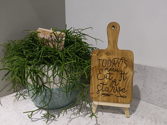 Today's menu, eat it or starve. Decorative board with display easel